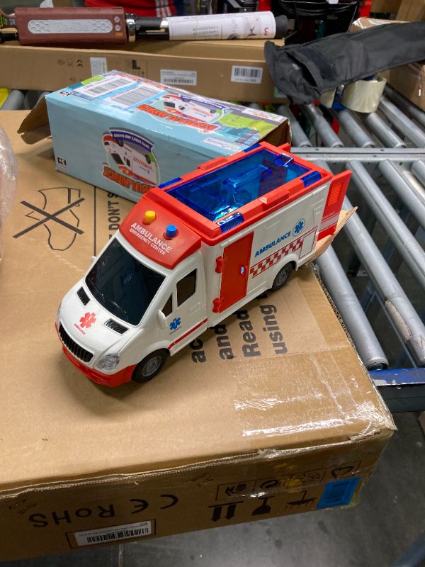 Photo 3 of Ambulance Toy Truck for Kids 3,4,5,6,7,8, Lights & Siren, Friction-Powered 1/16 Scale Rescue Toy Ambulance, Emergency Vehicle Toys with Removable Stretcher, Doors Open for Immersive Imagination