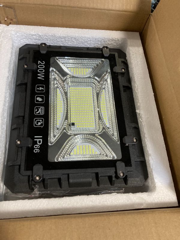 Photo 4 of * sale for part*  
TFKK 200W Solar Street Lights Outdoor, 7500K 16ft Wire Solar Parking Lot Lights, IP66 Waterproof Solar Flood Lights with Remote Control, Solar Street Lamps for Basketball Court, Road, Garden, Yard   ****USED***SOLAR PANEL IS MISSING*** 