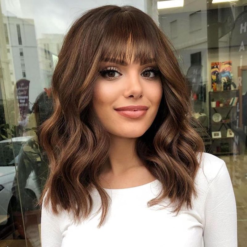 Photo 1 of AISI HAIR Synthetic Wavy Curly Bob Wig with Bangs Brown Highlight Wig Short Bob Wavy Hair Wigs for Women Synthetic Heat Resistant Bob Wigs