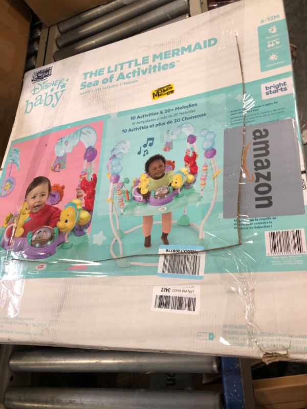 Photo 1 of Bright Starts Disney The Little Mermaid Sea of Activities Baby Activity Jumper with Interactive Toys, Lights & Music with Disney Princess Ariel, 6-12 Months (Blue) 
