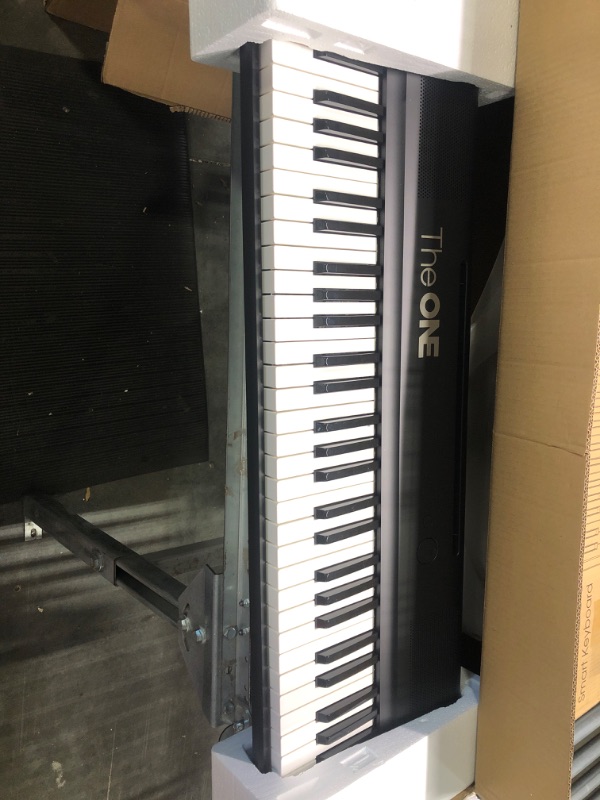 Photo 1 of The ONE Smart Keyboard COLOR 61 Lighted Keys Piano Keyboard, Electric Piano for Beginners with 256 Tones, 64 Polyphony, Built-in LED Lights and Free Apps (Black) Balck