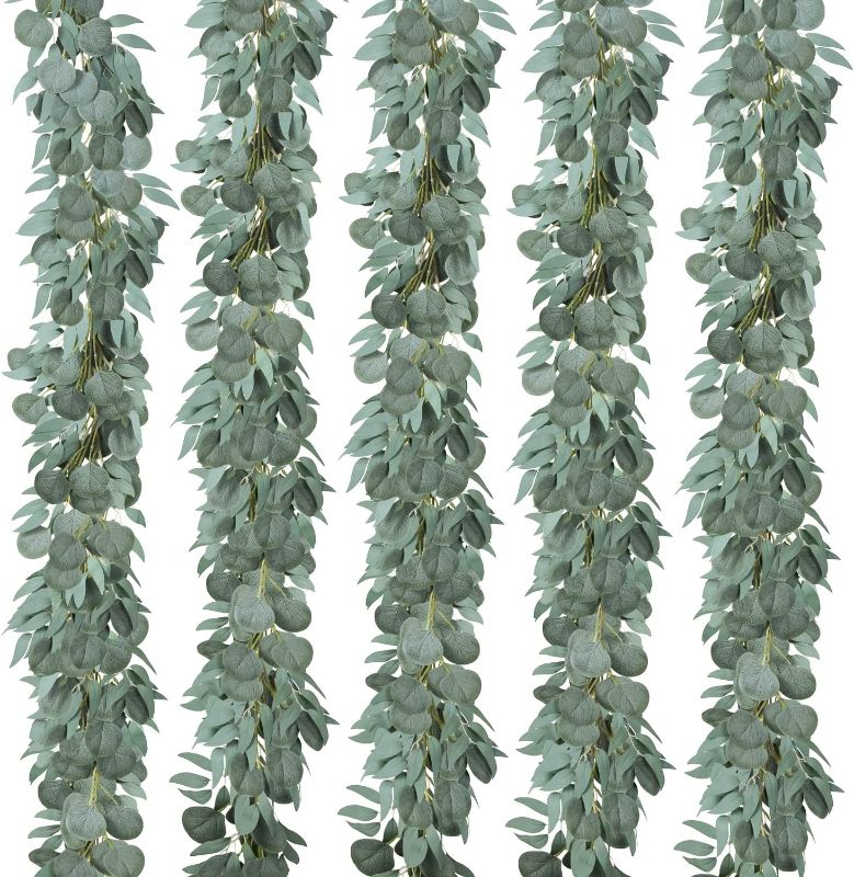 Photo 1 of USTOYOU 5 Pack Fake Silver Dollar Eucalyptus Greenery Garland Plants, 6.5 Feet Artificial Eucalyptus Leaves Vines for Wedding Table Backdrop Arch Wall Decor Runner Doorways Decoration Indoor Outdoor