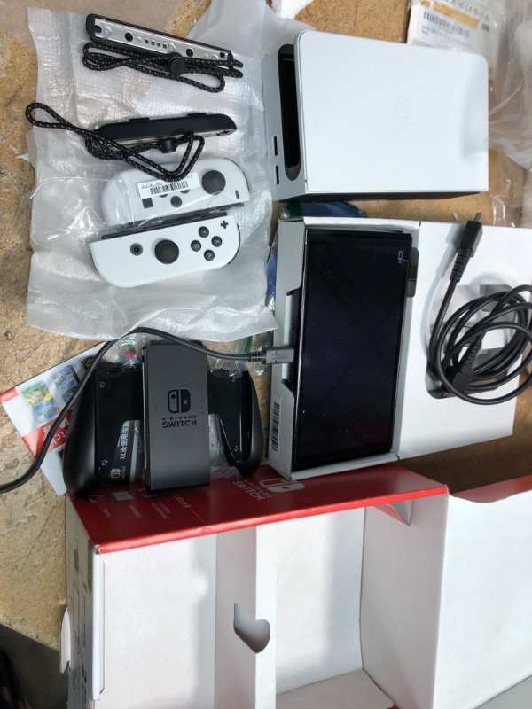Photo 1 of **unable to test** needs to be charged**
Nintendo Switch – OLED Model w/ White Joy-Con White Console