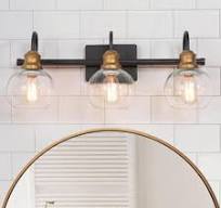 Photo 1 of 22 in. 3-Light Modern Aged Brass and Black Bathroom Vanity Light with Clear Glass Globe Shades