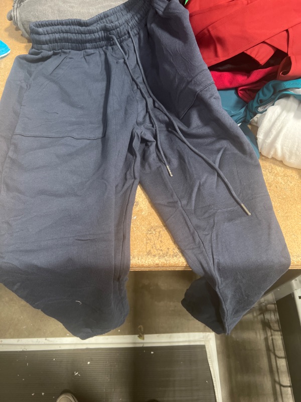 Photo 1 of dark blue sweat pants for kids size small 