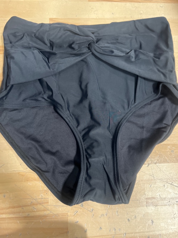 Photo 1 of Black high waisted bow swim bottoms size small 