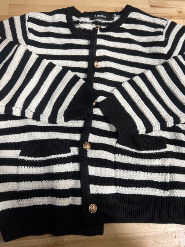 Photo 1 of Black and white striped knitted sweater size large 