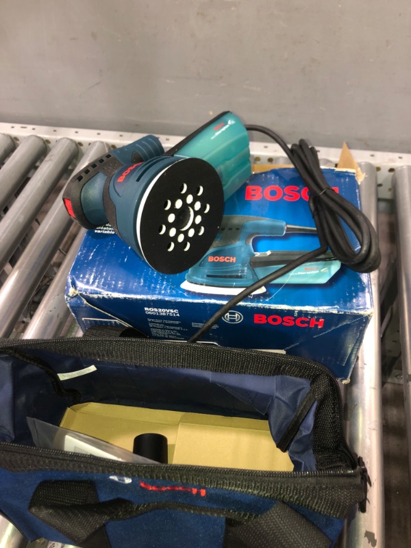 Photo 2 of Bosch ROS20VSC Palm Sander - 2.5 Amp 5 in. Corded Variable Speed Random Orbital Sander/Polisher Kit with Dust Collector and Soft Carrying Bag