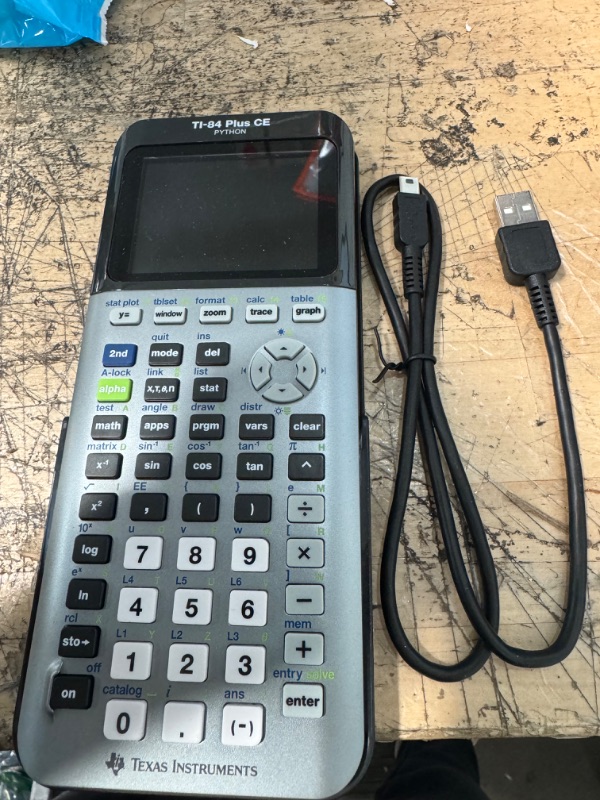 Photo 2 of Texas Instruments - - Texas Instruments TI-84 Plus CE Graphing Calculator - Impact Resistant Cover, Clock, Date/Time Display - 3 MB, 154 KB - ROM, RAM - Battery Powered - Space Gray