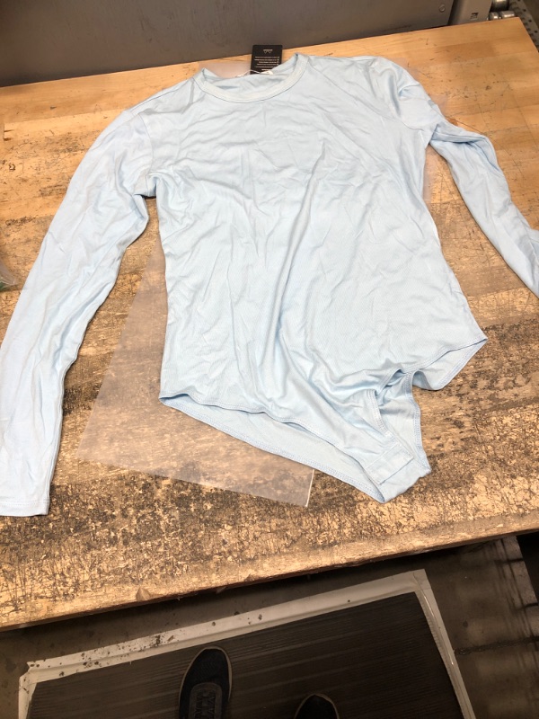 Photo 1 of medium baby blue long sleeve bodysuit 