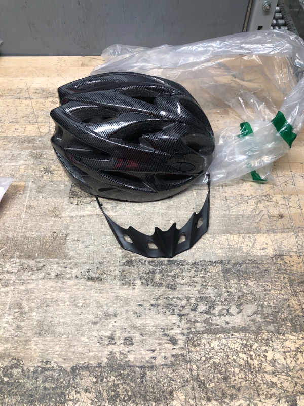 Photo 1 of **see photos for size**
black bicycle helmet 