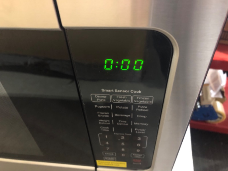 Photo 4 of ***USED - POWERS ON - UNABLE TO TEST FURTHER***
Farberware Countertop Microwave Oven 2.2 Cu. Ft. 1100 Watt, with Smart Sensor Cooking, ECO Mode and LED Lighting, Child Lock, Easy Clean Black Interior, Stainless Steel 2.2 Cu. Ft Stainless Sensor