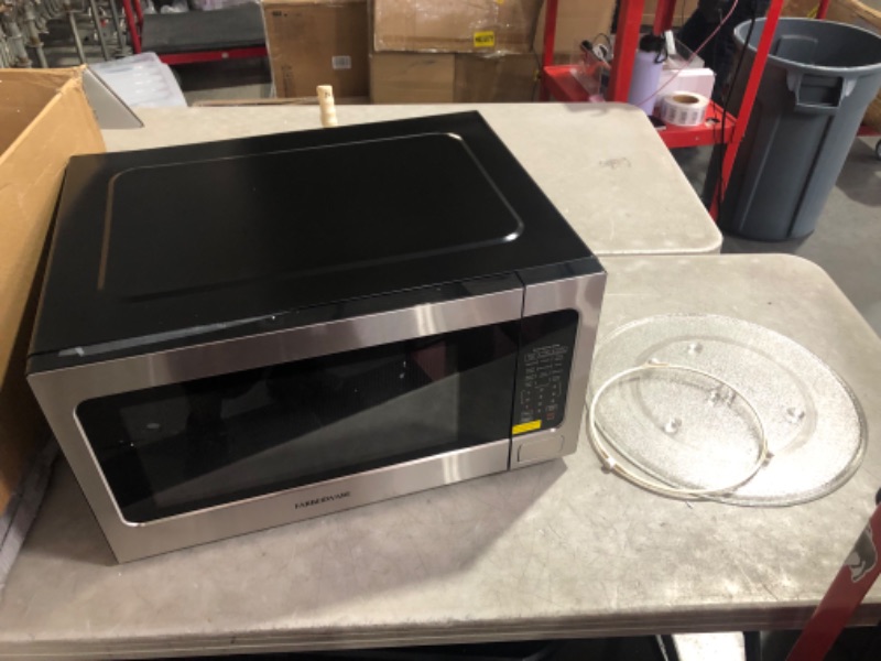 Photo 7 of ***USED - POWERS ON - UNABLE TO TEST FURTHER***
Farberware Countertop Microwave Oven 2.2 Cu. Ft. 1100 Watt, with Smart Sensor Cooking, ECO Mode and LED Lighting, Child Lock, Easy Clean Black Interior, Stainless Steel 2.2 Cu. Ft Stainless Sensor