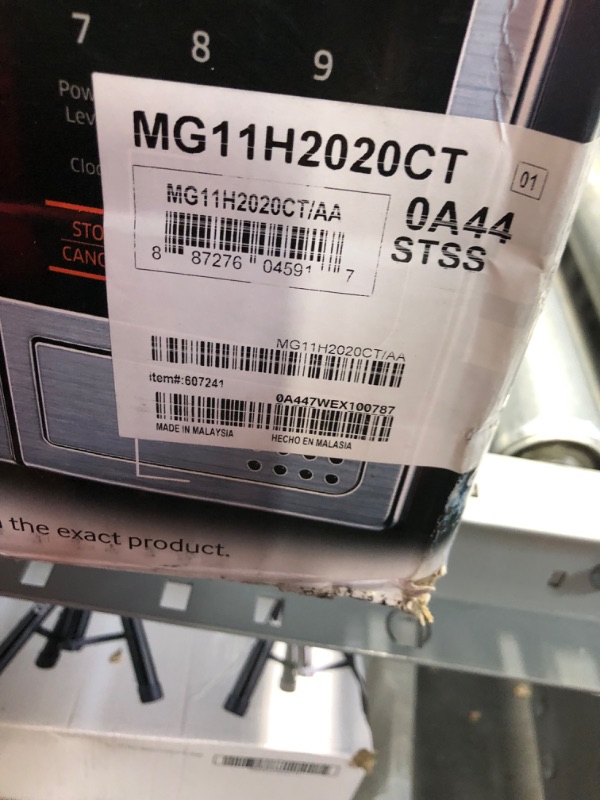 Photo 3 of **MAJOR DENT IN SIDE UNTESTED**
SAMSUNG 1.1 Cu Ft Countertop Microwave Oven w/ Grilling Element, Ceramic Enamel Interior, Auto Cook Options,1000 Watt, MG11H2020CT/AA, Stainless Steel, Black w/ Mirror Finish,15.8"D x 20.4"W x 11.7"H
