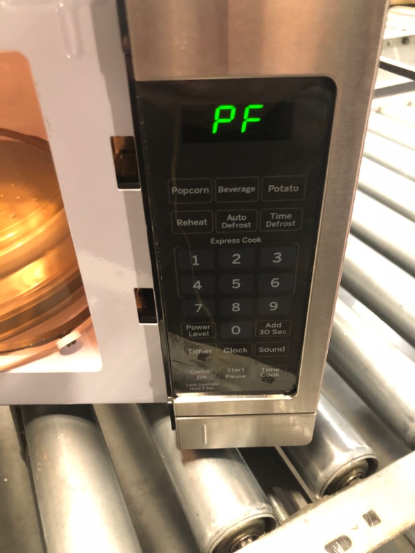 Photo 4 of **PARTS ONLY// NONREFUNDABLE// DAMAGE TO DOOR**
GE Countertop Microwave Oven | 0.7 Cubic Feet Capacity, 700 Watts | Kitchen Essentials for the Countertop or Dorm Room | Stainless Steel