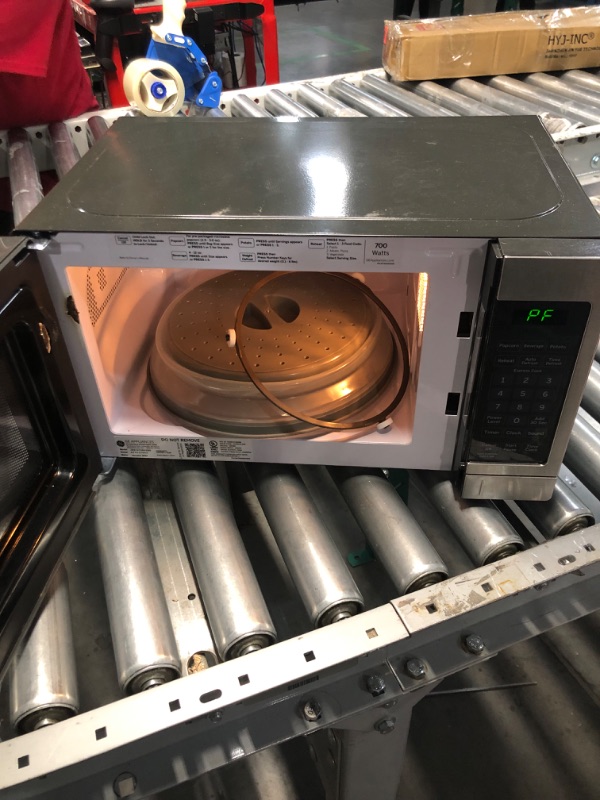 Photo 3 of **PARTS ONLY// NONREFUNDABLE// DAMAGE TO DOOR**
GE Countertop Microwave Oven | 0.7 Cubic Feet Capacity, 700 Watts | Kitchen Essentials for the Countertop or Dorm Room | Stainless Steel