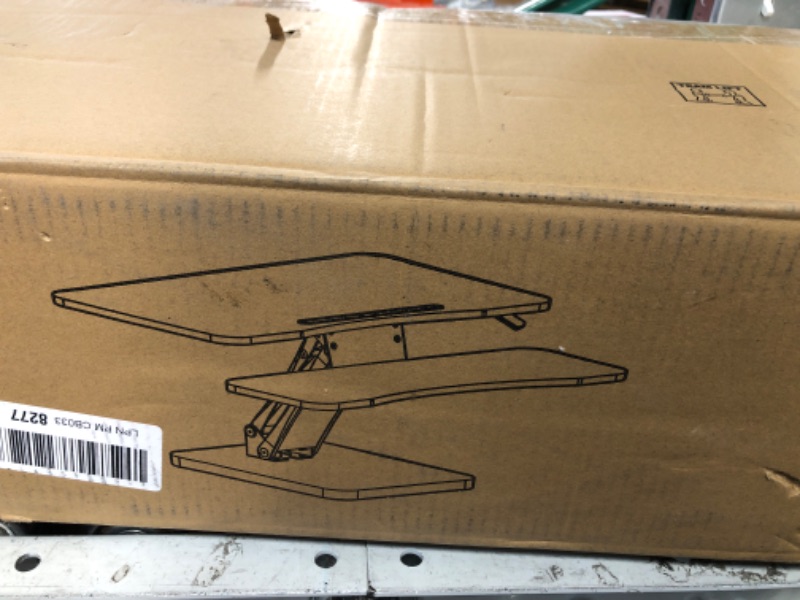 Photo 1 of HUANUO Standing Desk Converter, 32 inch Sit to Stand Riser, Height Adjustable Standing Desk Riser, Black