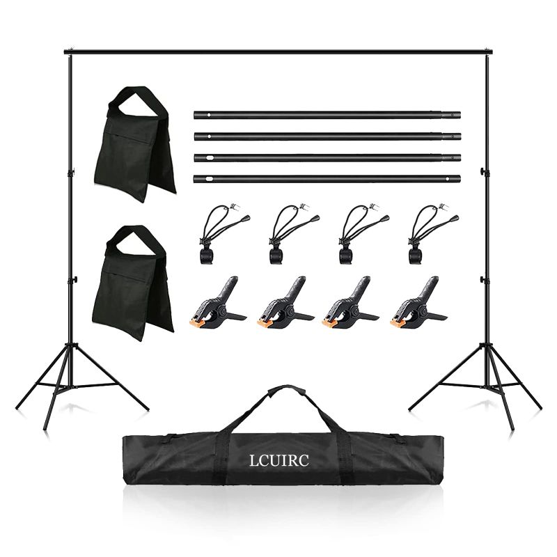 Photo 1 of LCUIRC Photo Backdrop Stand, 6.5x10ft Background Stand Kit with 4 Crossbars, 4 Spring Clamps, 4 Backdrop Clips, 2 Sandbags, and Carrying Bag for Parties Decoration