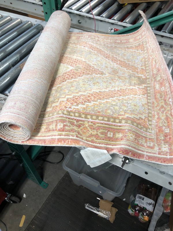 Photo 1 of **General post** Rough measurements
 2ft by 6inchs pink white and light brown rug 