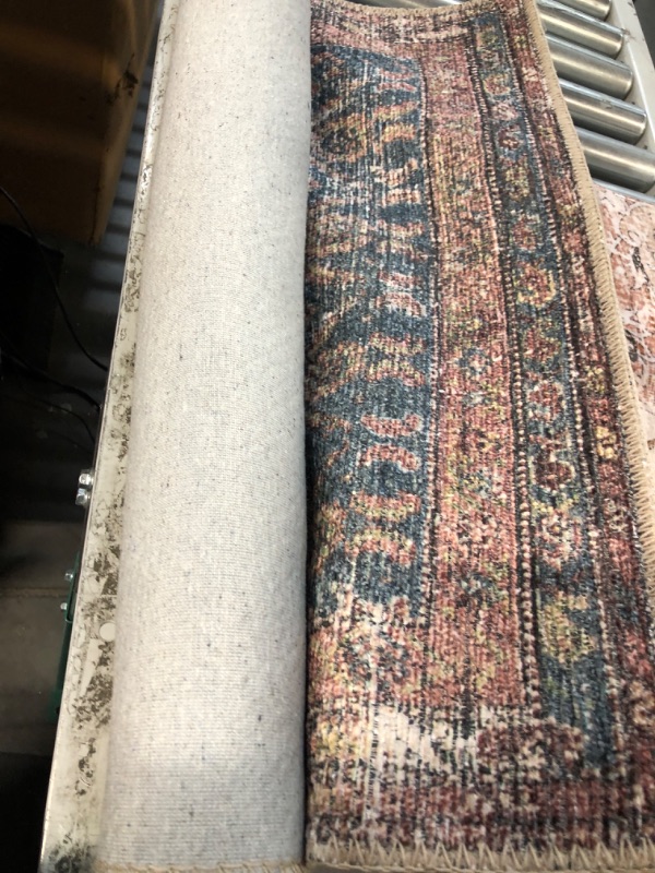 Photo 1 of **General post** Rough measurements
2ft 6inch by 4ft area rug rust blue, red, and white 