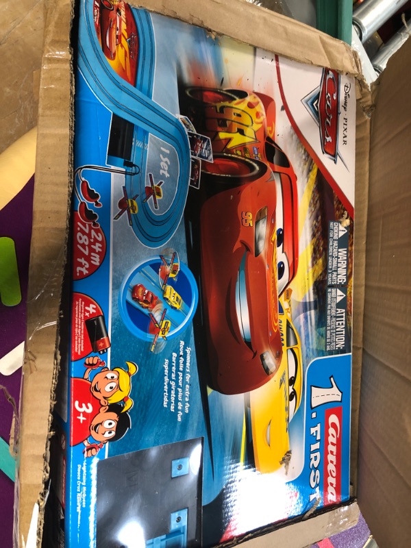 Photo 2 of Carrera First Disney/Pixar Cars - Slot Car Race Track - Includes 2 Cars: Lightning McQueen and Dinoco Cruz - Battery-Powered Beginner Racing Set for Kids Ages 3 Years and Up Disney Cars w/ Spinners