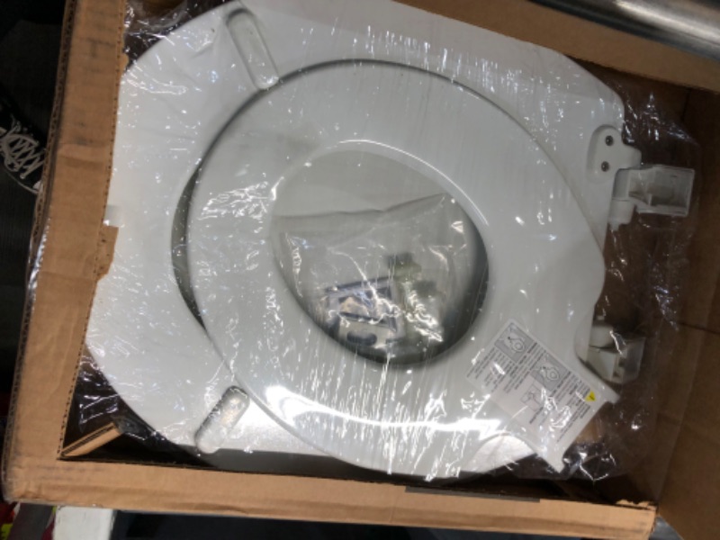 Photo 2 of **MINOR DAMAGE PIECE BROKE OFF STILL FUNCTIONAL**
MAYFAIR 888SLOW 000 NextStep2 Toilet Seat with Built-In Potty Training Seat, Slow-Close, Removable that will Never Loosen, ROUND, White Round White