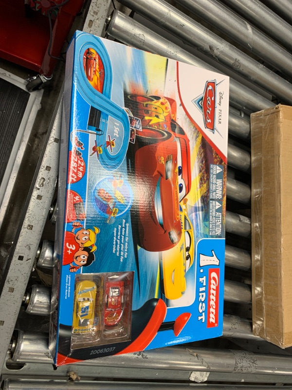 Photo 2 of Carrera First Disney/Pixar Cars - Slot Car Race Track - Includes 2 Cars: Lightning McQueen and Dinoco Cruz - Battery-Powered Beginner Racing Set for Kids Ages 3 Years and Up Disney Cars w/ Spinners