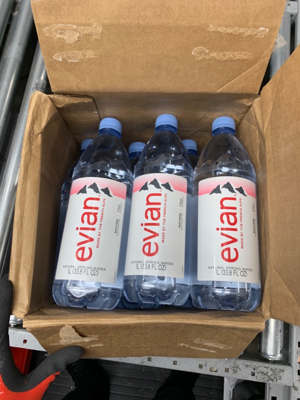 Photo 2 of  **NOTES** evian Natural Spring Water, Naturally Filtered Spring Water in Large Bottles, 33.81 Fl Oz (Pack of 12)
