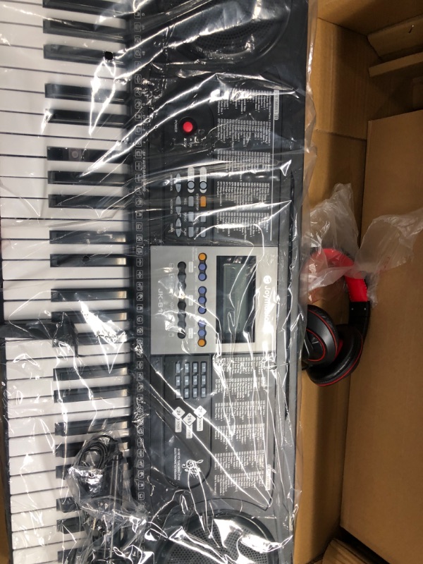 Photo 3 of 61-Key Electronic Keyboard Pack with Headphones,Microphone,Stand,Stool,and Power Supply-The electronic keyboards (Pack of 1) Kit Packing