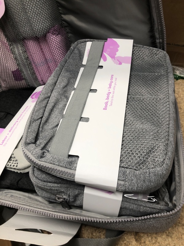 Photo 1 of Frida Mom Motherload[ed] Hospital Bag - Pre-Packed Essentials for Labor and Delivery, Postpartum Recovery and Baby (30 Piece Gift Set)