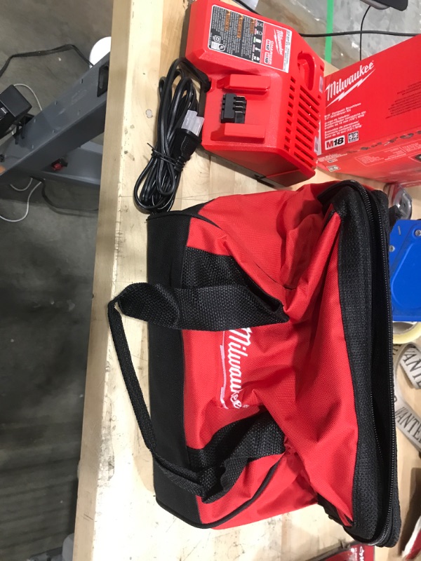 Photo 1 of MISSING THE DRILL AND BATTERY ***Milwaukee M18 18V Lithium-Ion Brushless Cordless 1/2 in. Compact Drill/Driver with One 2.0 Ah Battery, Charger and Tool Bag
