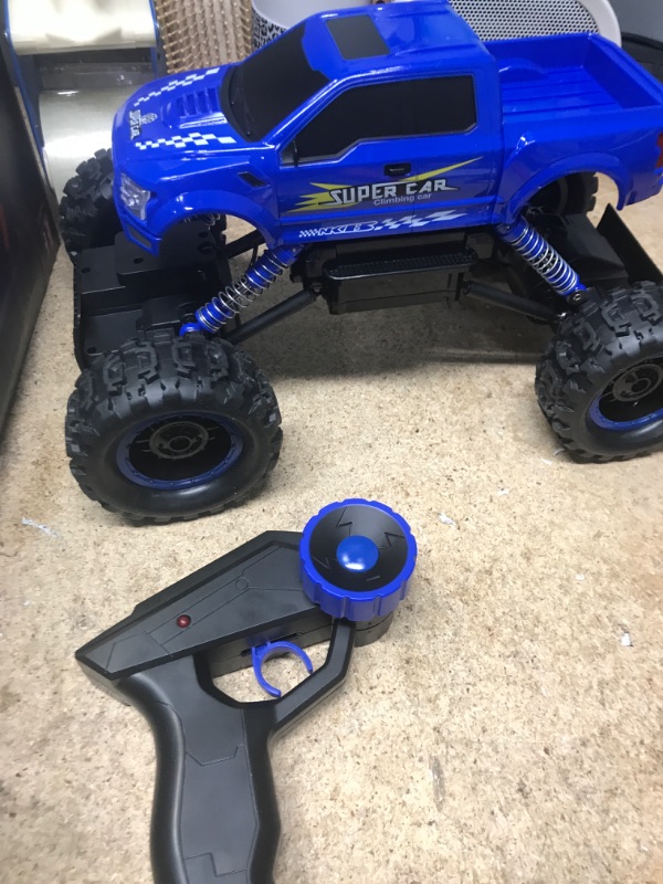 Photo 2 of DOUBLE E RC Cars Remote Control Car 1:12 Off Road Monster Truck for Boy Adult Gifts,2.4Ghz All Terrain Hobby Car,4WD Dual Motors LED Headlight Rock Crawler Blue Large