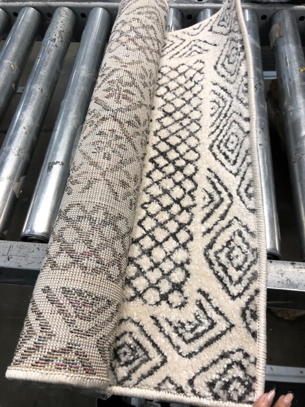 Photo 1 of 2' x 6' white-off runner rug 