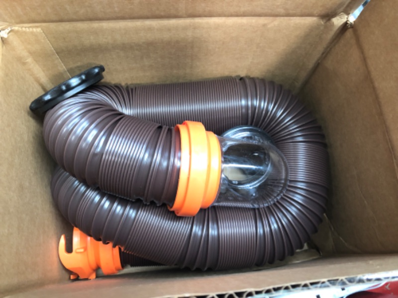 Photo 2 of Camco RhinoFLEX RV Sewer Hose Kit with Swivel Transparent Elbow and 4-in-1 Dump Station Fitting, Brown, 15 Feet (39770) 15ft Sewer Hose Kit Frustration-Free Packaging