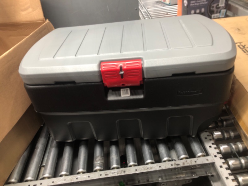 Photo 1 of Rubbermaid Action Packer Lockable Industrial Storage Container with Wheels, 35 Gal 1 Pack, Black, Mica & Red 35 Gal Wheeled - 1 Pack