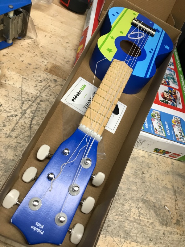 Photo 2 of **TWO STRINGS NEED TO BE ATTACHED**
Pidoko Kids Wooden Toy Guitar Ukulele - Musical Instruments for Toddlers Boys and Girls
