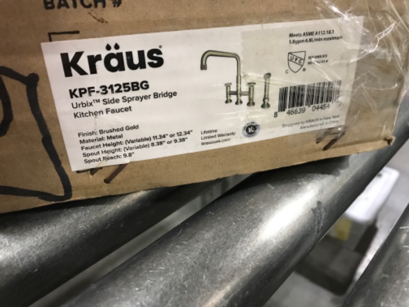 Photo 3 of KRAUS Urbix Industrial Bridge Kitchen Faucet with Side Sprayer in Brushed Gold, KPF-3125BG Brushed Gold Industrial Style Bridge Faucet