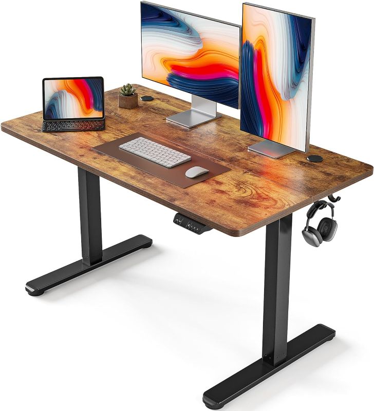 Photo 1 of FEZIBO Electric Standing Desk, 48 x 24 Inches Height Adjustable Stand up Desk, Sit Stand Home Office Desk, Computer Desk, Rustic Brown
