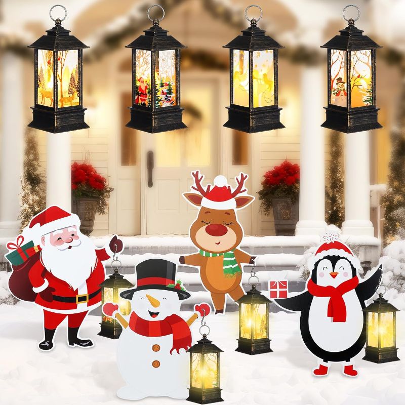 Photo 1 of ROCEEI 4 Set Christmas Lighted Metal Yard Stakes 25.5 Inch Snowman Santa Claus Reindeer Penguin Lights Yard Signs with Mini Vintage LED Hanging Lantern for Xmas Holiday Lawn Outdoor Decoration 