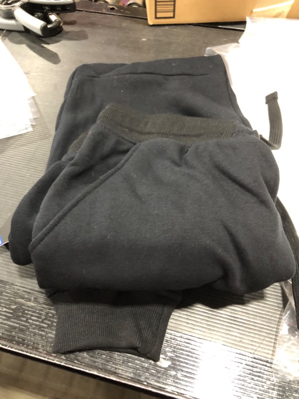 Photo 1 of LARGE BLACK JOGGERS.