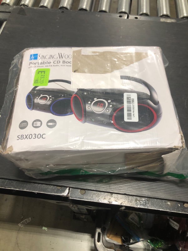 Photo 2 of SINGING WOOD 030C Portable CD Player Boombox with AM FM Stereo Radio, Aux Line in, Headphone Jack, Supported AC or Battery Powered (Black with a Touch of Blue Rims) Black with Blue Rim