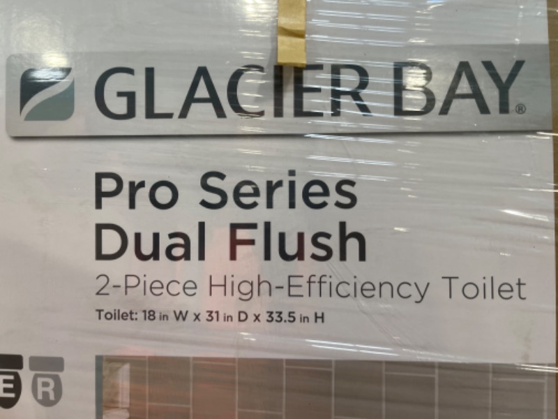 Photo 3 of 2-piece 1.1 GPF/1.6 GPF High Efficiency Dual Flush Complete Elongated Toilet in White, Seat Included