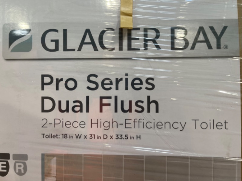 Photo 1 of 2-piece 1.1 GPF/1.6 GPF High Efficiency Dual Flush Complete Elongated Toilet in White, Seat Included