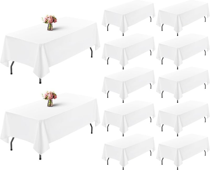 Photo 1 of 12 Pack Table Cloth White Tablecloth 60 x 102 Inch Table Clothes for 6 Foot Rectangle Tables, Wrinkle Resistant Washable Polyester Table Cover for Wedding Parties Banquet Camping Dining Table
