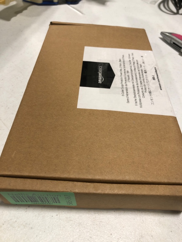 Photo 1 of Amazon Basics 6-Outlet, 200 Joule Surge Protector Power Strip, 2 Foot, Black - Pack of 2 Black Strip