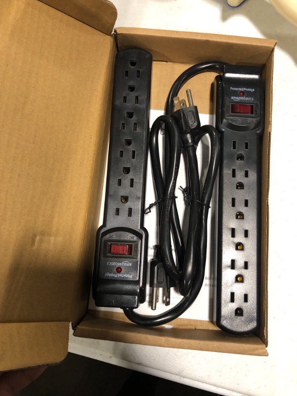 Photo 1 of Amazon Basics 6-Outlet, 200 Joule Surge Protector Power Strip, 2 Foot, Black - Pack of 2 Black Strip