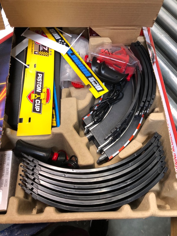 Photo 2 of Carrera GO!!! 62477 Disney Pixar Cars Neon Nights Electric Slot Car Racing Kids Toy Race Track Set Includes 2 Controllers and 2 Cars in 1:43 Scale Disney Cars Neon