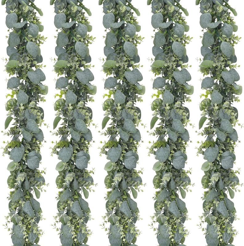 Photo 3 of CEWOR 5pcs 5.5ft Artificial Eucalyptus Garland Fake Silver Dollar Eucalyptus Greenery Garland Vines Table Runner for Wedding Arch Backdrop Table Centerpiece Home Mantle Decor