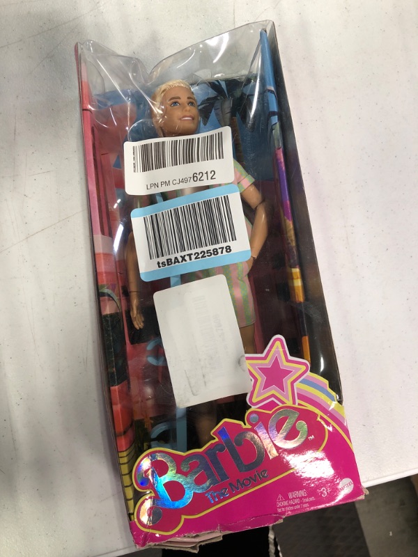 Photo 1 of Barbie The Movie Ken Doll Wearing Pastel Pink and Green Striped Beach Matching Set with Surfboard and White Sneakers