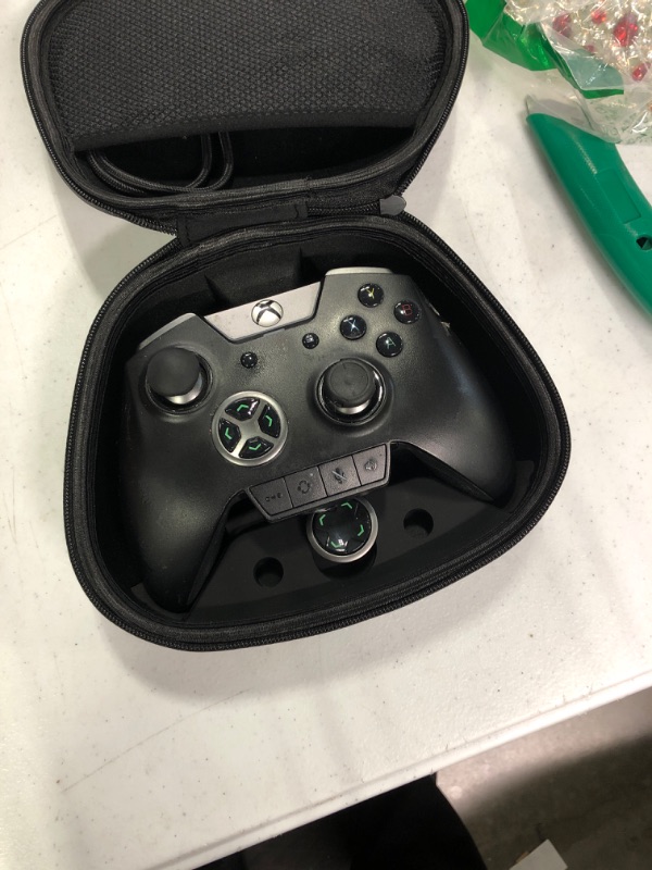 Photo 3 of *****very used, dirty around the controller, need deep clean*****Razer Wolverine Ultimate Officially Licensed Xbox One Controller: 6 Remappable Buttons and Triggers - Interchangeable Thumbsticks and D-Pad - For PC, Xbox One, Xbox Series X & S - Black